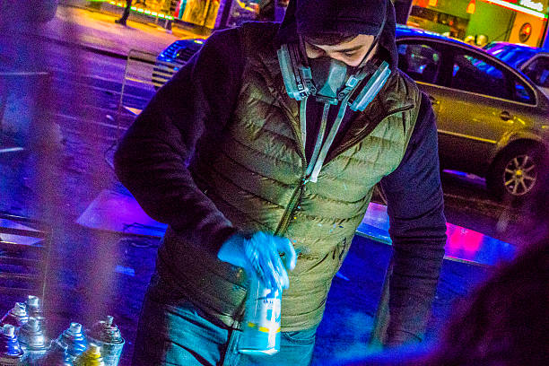 Young man make aerography painting for public at Time Square