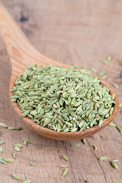 istock fennel seed in a wooden spoon on table 598170700