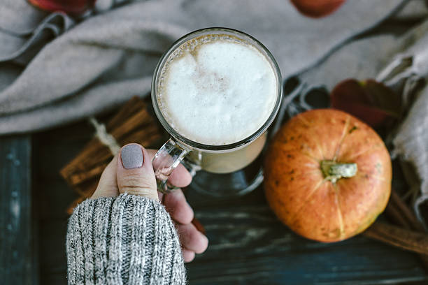 istock Woman Hands with Spicy pumpkin latte 598171158