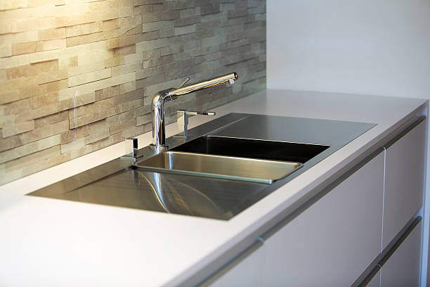 istock close up of stainless steel kitchen sink 598171820