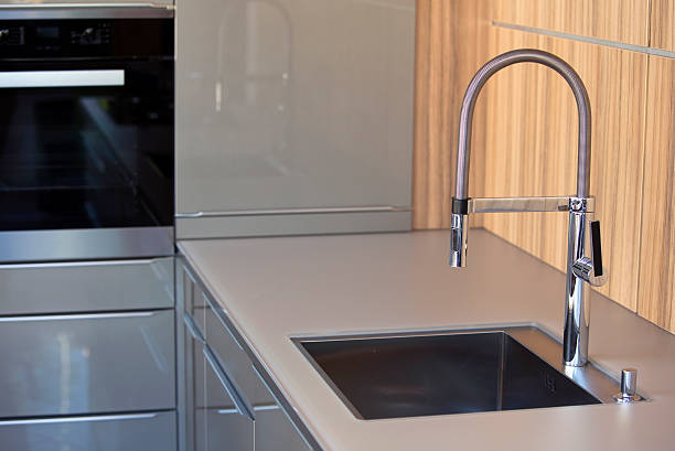 istock stylish grey kitchen with stainless steel sink 598171870
