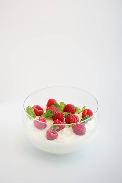 istock Red Raspberries in bowl of Yoghurt 598171904