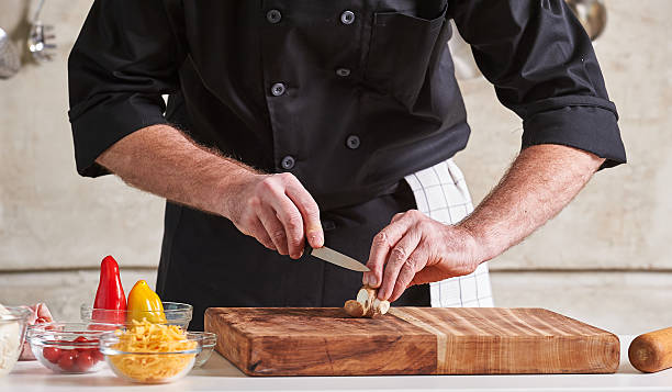 istock Restuarant hotel private chef cutting mushrooms on board 598172142