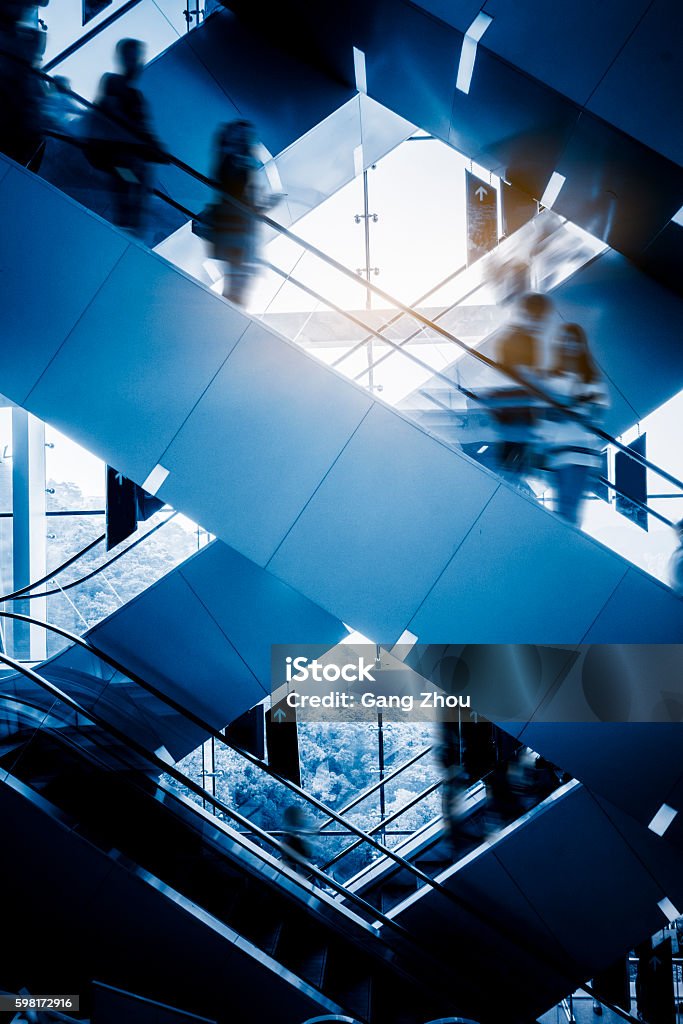 People at the airport escalator.Motion blur People at the airport escalator.Motion blur.hong kong. Office Stock Photo