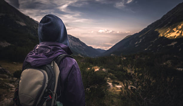 istock Traveler watching the sunset over the mountains 598173608