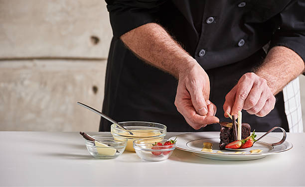istock Restaurant hotel private chef preparing desert chocolate cake 598175566