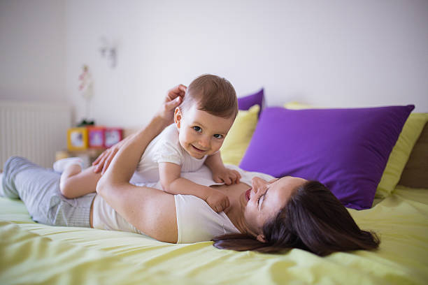 istock Mother cuddles with child 598175920
