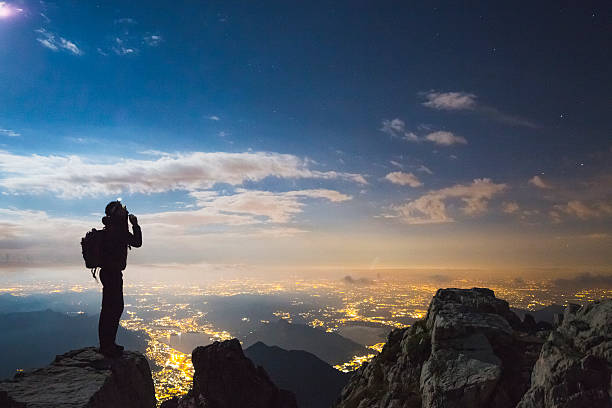 istock Hiker top of the mount at night 598176378