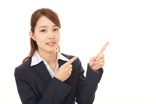 Business woman pointing with her fingers