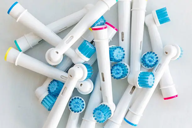 Electronic toothbrush heads isolated on a white background.