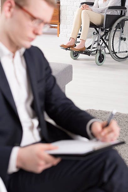 istock Patient on wheelchair at psychotherapist 598178682