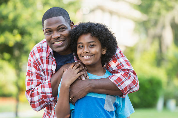 istock Father and mixed race preteen son 598178792