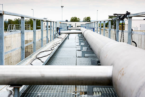 Wastewater treatment Water pumping station Wastewater treatment plant pipes. Water pumping station. Wastewater treatment is a process used to convert dirty wastewater into an effluent that can be either returned to the water cycle with minimal environmental issues or reused. aquatic plant stock pictures, royalty-free photos & images