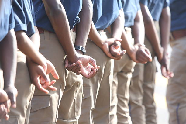 South African metro police stand guard at a funeral.
