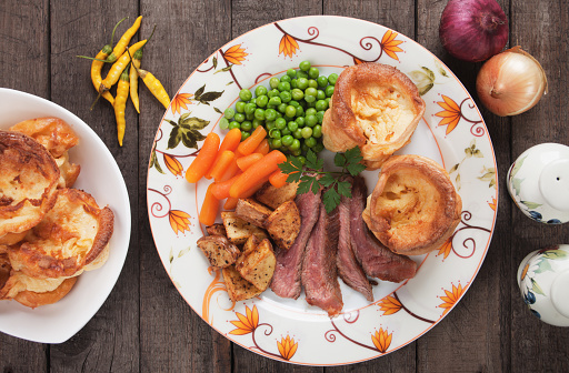 Traditional british sunday roast with yorkshire pudding, roasted potato and vegetables