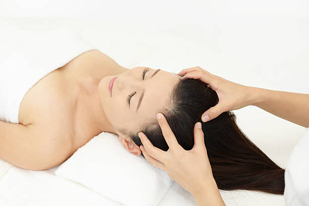 istock Woman receives head massage 598217128