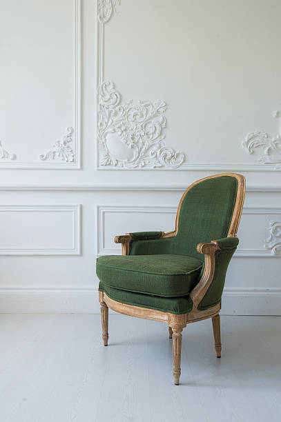 istock One classic armchair against a white wall and floor. Copy 598217732