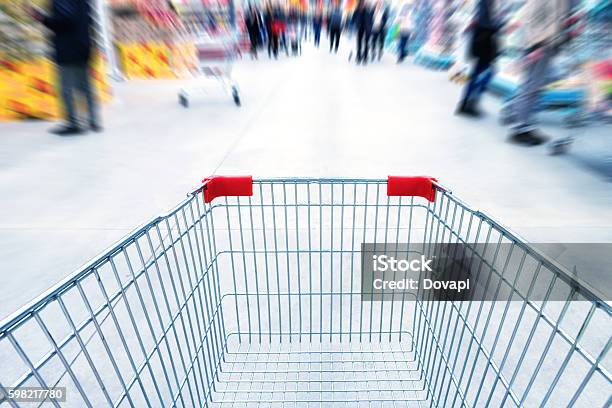 Empty Trolley In Supermarket Stock Photo - Download Image Now - Shopping Cart, Supermarket, Crowd of People