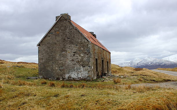 istock Abandoned Red Tin Roofed Stone House 598219450