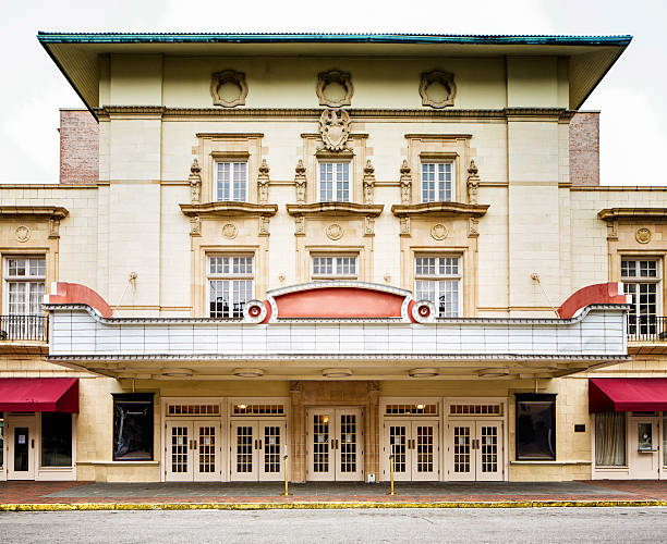 Colonial style southern USA movie theater concert hall facade Colonial style southern USA movie theater concert hall facade with curb and sidewalk. entrance sign photos stock pictures, royalty-free photos & images