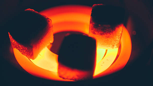 istock coconut charcoal for hookah on red-hot spiral 598220900