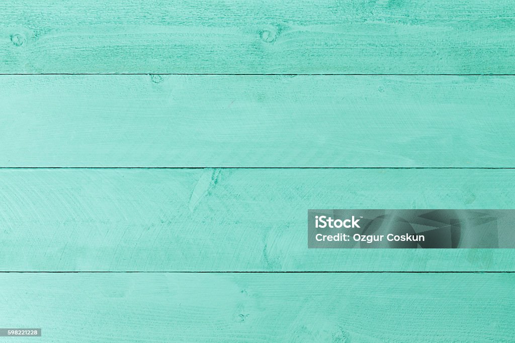 Pastel green stained wood background texture Pastel green stained wood background texture with horizontal parallel boards, woodgrain and copy space, full frame Wood - Material Stock Photo