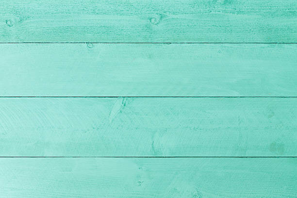 Pastel green stained wood background texture Pastel green stained wood background texture with horizontal parallel boards, woodgrain and copy space, full frame green painted wood texture stock pictures, royalty-free photos & images