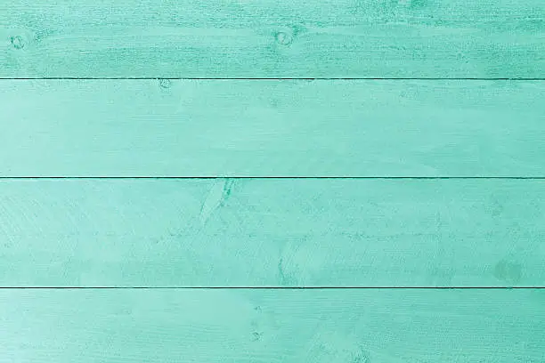 Photo of Pastel green stained wood background texture