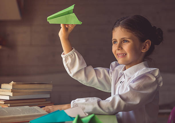 istock Charming little school girl 598221254