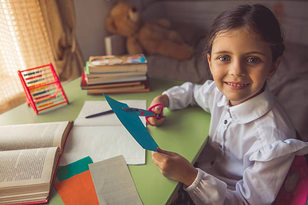 istock Charming little school girl 598221340