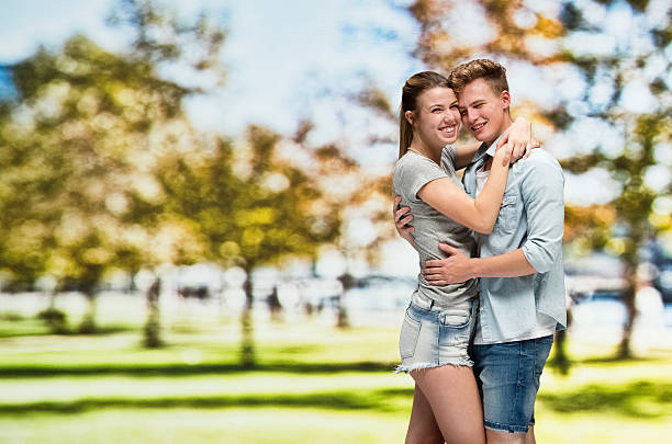 istock Happy couple embracing outdoors 598221886