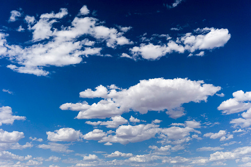 horizontal background with blue sky and clouds
