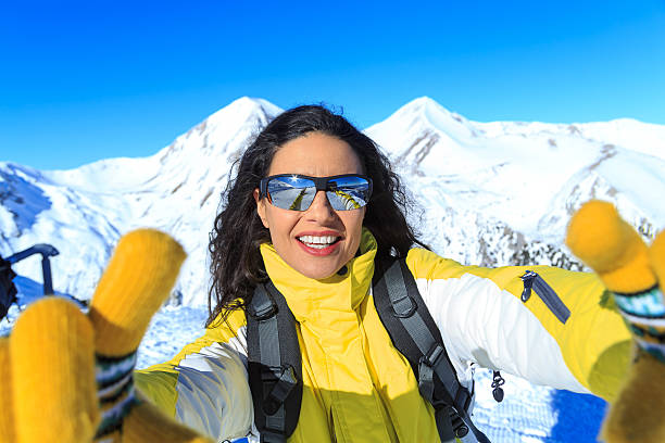 istock Female skier making selfie on top mountain 598223510