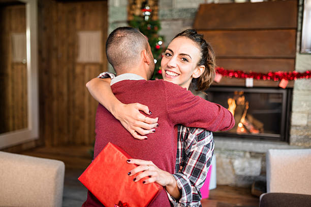 istock giving the present to the girlfriend for christmas 598224092