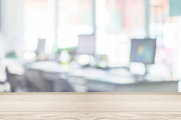 istock Businessmen blur in the workplace.Table Top And Blur Office 598225804