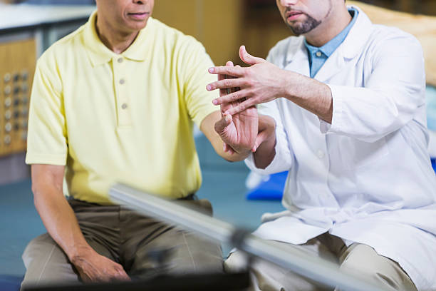 Hispanic physical therapist, African American patient