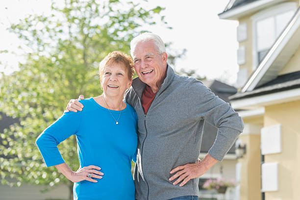 istock Loving senior couple standing outside home 598227632