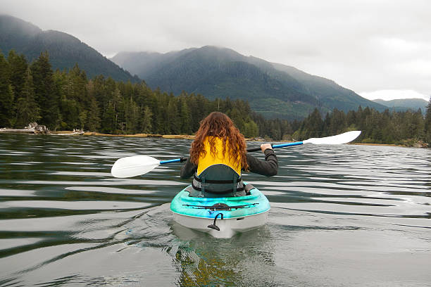 Kayaking Person kayaking on a river. port renfrew stock pictures, royalty-free photos & images