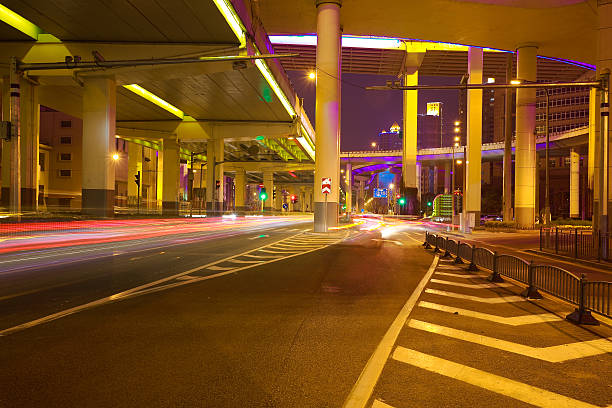 istock Empty road floor with city elevated bridge of night 598228012