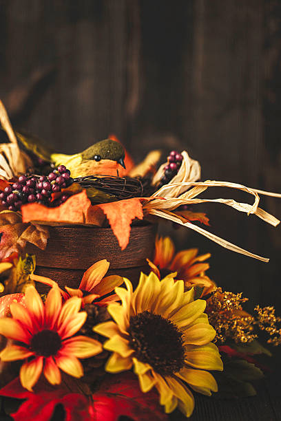 istock Thanksgiving still life background with sunflowers and bird 598229208