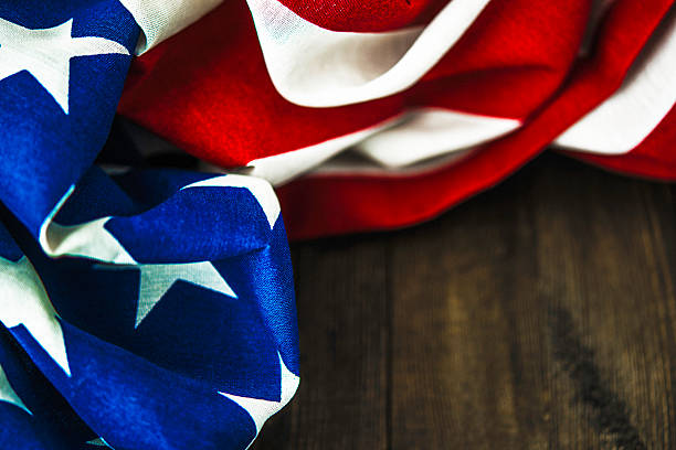 istock American flag on wood table for US holidays 598229276