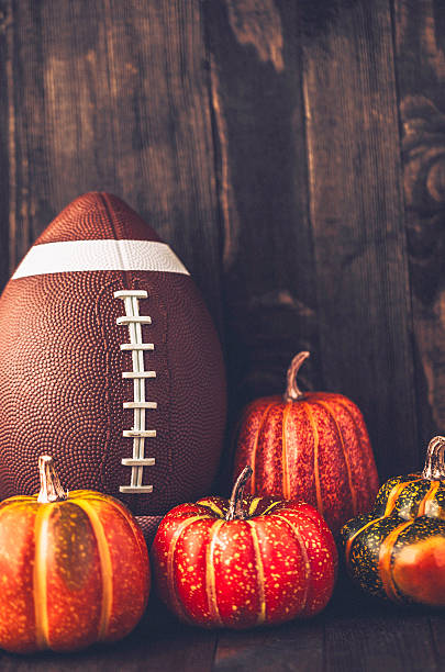 istock American football with assorted pumpkins 598229304