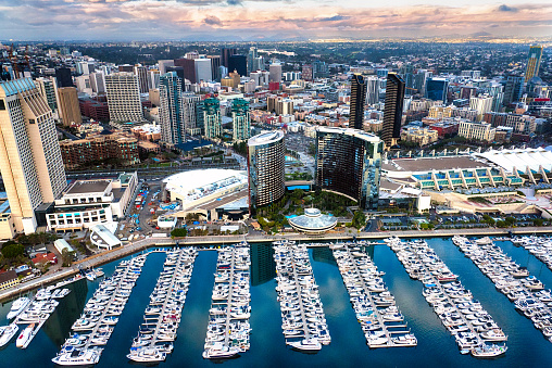 The expansive downtown area of San Diego, California with the Marriot Hotel, marina, and Convention Center in the foreground.