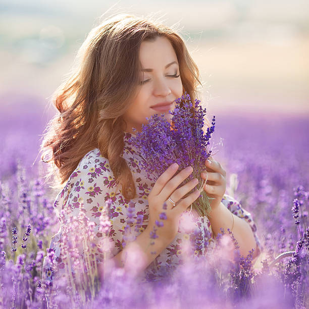 istock Beautiful woman in a lavender field 598230298