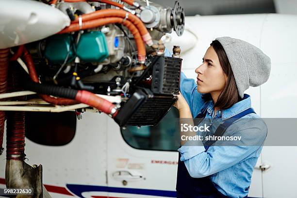 Repairing Airplane Motor Stock Photo - Download Image Now - Airplane Mechanic, Air Vehicle, Mechanic