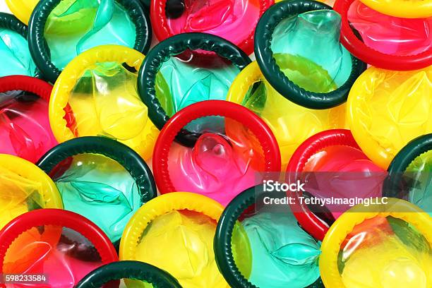 Colored Condoms Close Up Stock Photo - Download Image Now - Condom, Multi Colored, Backgrounds
