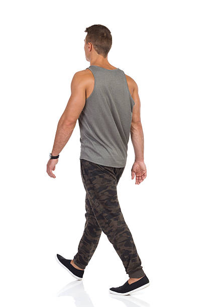 istock Walking Young Man In Camo Pants Rear View 598233824