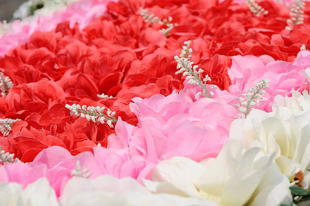 istock Red pink and white artificial flowers for background. 598233986