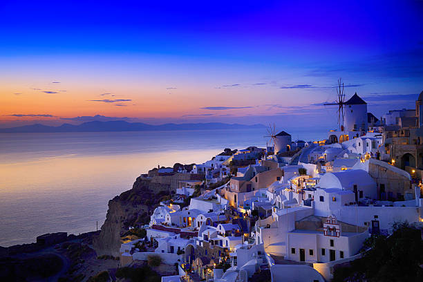 Night view of Santorini island, Greece. Buildings and sea.