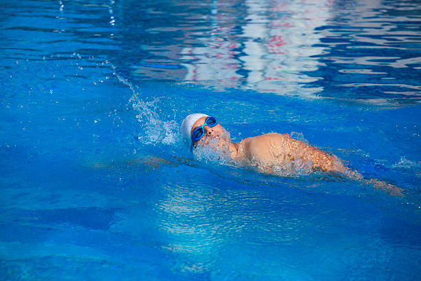 istock Young man swimming in a pool    Male swimmer 598238706